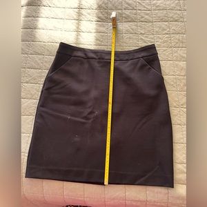 J. Crew black skirt size 14. Pockets, back zipper , side slit